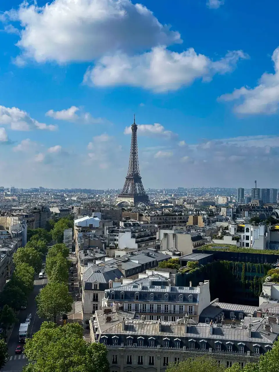 View over Paris rooftops toward the Eiffel Tower.